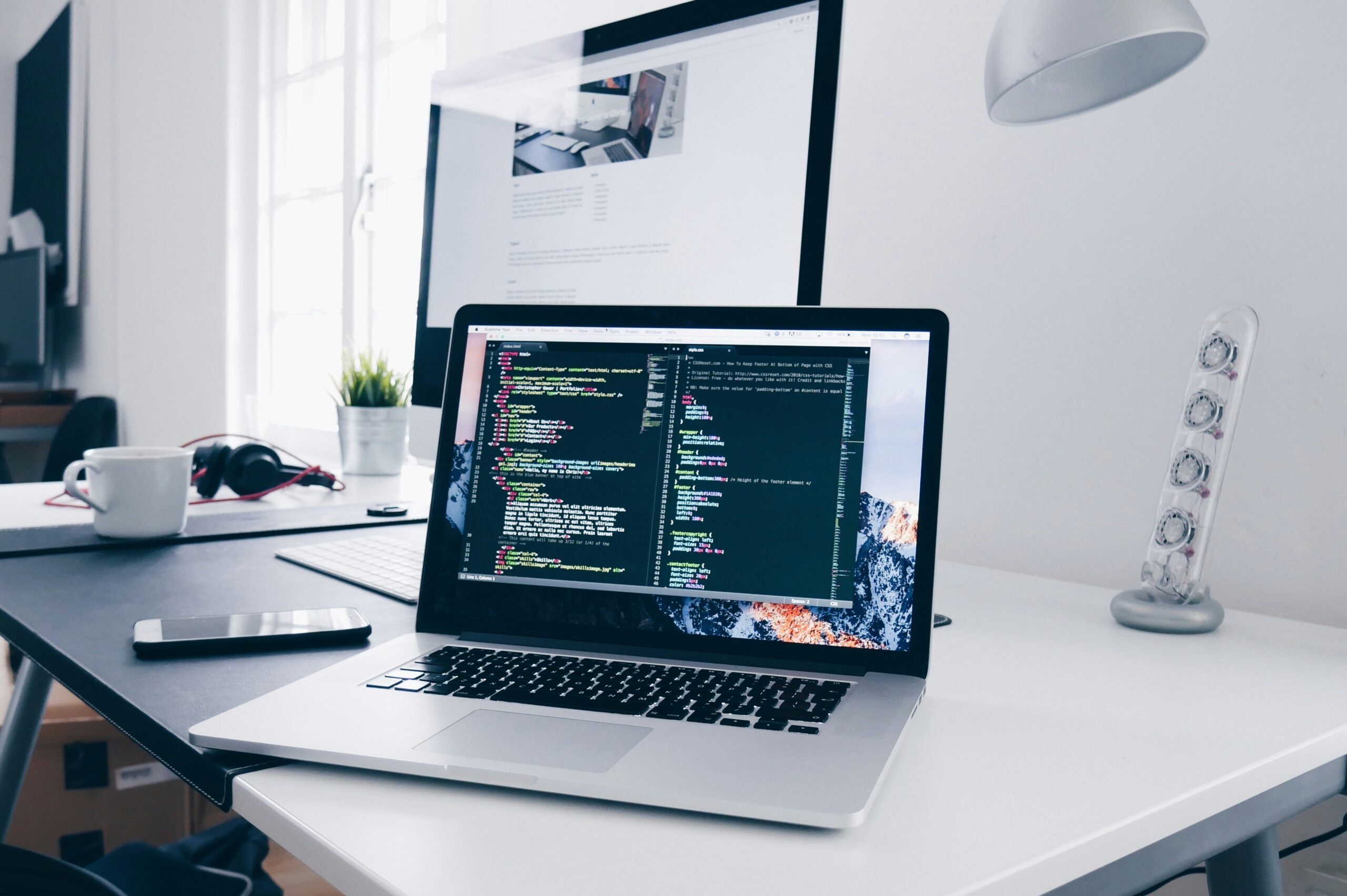 code on a computer on top of a desk